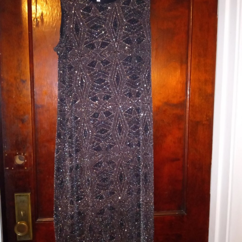A Stunning Black & Gold sleeveless evening gown with spice-up any closet